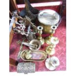 Assorted brass ware consisting of coal bucket, candlesticks, pestle and mortars, a decorative wall