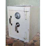 A combination safe and key entry enclosed by single door, possibly by Chubb, together with