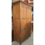 A large (tall) Gothic revival oak wardrobe of knockdown form enclosed by a pair of full length