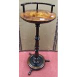 A Victorian mahogany and ebonised circular occasional table, the disk base supporting a turned