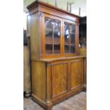 Small Regency mahogany library bookcase, the lower section enclosed by a pair of panelled doors with