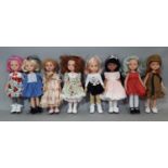 8 dolls by Paola Reina, heights 32-34cm each with individual facial features and clothing styles (8)