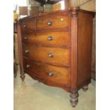 A Victorian mahogany bow fronted bedroom chest of three long and two short graduated drawers flanked