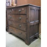 A Georgian oak two sectional bedroom chest of four long drawers flanked by moulded panelled sides