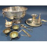 A silver plated fruit bowl with lion mask handles 21cm diam, a silver plated chamber stick , wick