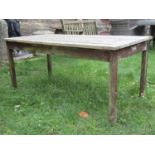 A Britannic stained teak garden table of rectangular form with slatted top and square cut