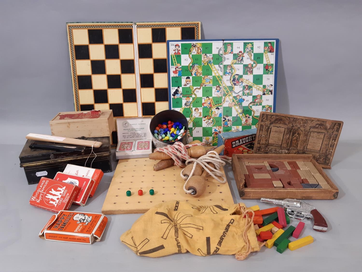 Box of vintage toys and games including skipping ropes, draughts, chess, 'Richter Anchor Box' of