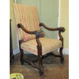 A late 19th century open elbow chair with carved and moulded framework, with lions mask and acanthus