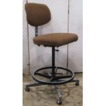 A Tan-sad Nova vintage swivel office chair with upholstered seat and back raised on a tubular
