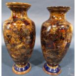 A pair of Doulton Lambeth oviform vases with abstract leaf decoration with retail label by Hayward &