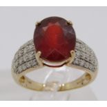9ct oval garnet and diamond cluster dress ring, size N, 4.5g