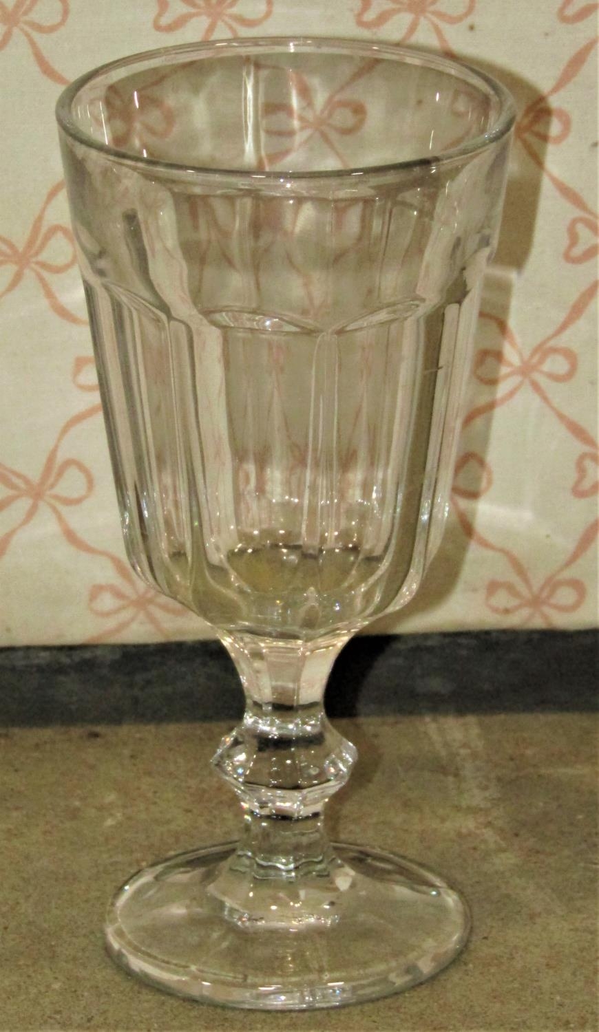 Sixty two moulded stemmed glasses in the Georgian style, 16 cm high