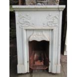 An Art Nouveau/crafts painted cast iron fireplace/insert, with scrolling organic detail, 94 cm