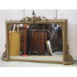 A Victorian gilt framed overmantel mirror of rectangular form with repeating flowerhead and bead