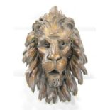 A 19th century carved wooden mask of a lion’s head and mane 40cm x 30cm approx