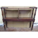 An unusual 19th century mahogany and pine two tier bookcase or stand, with two tiers on turned