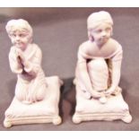 Two Minton Parian figures of children in kneeling poses, the boy praying, the girl tying her shoe