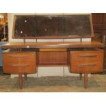 A G plan Fresco teak dressing table with rectangular mirror over an arrangement of five drawers