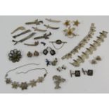 Collection of Eastern style silver and white metal jewellery, to include a quantity of brooches in