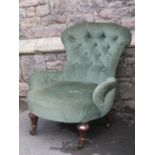 A Victorian low nursing or drawing room chair with shaped outline, buttoned green upholstery and