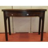 Georgian mahogany serpentine foldover tea table raised on four square moulded supports, enclosing