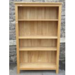 A contemporary light wood freestanding open bookcase with three adjustable shelves, 97cm wide x 31cm