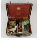 Suitcase containing a collection of interesting effects to include a gold plated watch upon