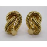 Pair of 18ct rope twist knot design earrings with clip fastenings, 21.2g