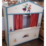 Vintage wooden puppet theatre together with a collection of Tintin themed hand puppets. Theatre