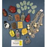 A collection of Chinese snuff bottles in glass simulated cinnabar lacquer etc, carved marble tablets