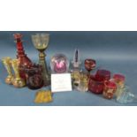 A mixed selection of glass ware including an amber wine glass on a coiled foot, a Bohemian red glass