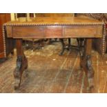 A Regency rosewood sofa table, raised on a stretcher base, the top with gadrooned borders, the