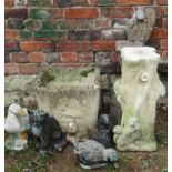 A weathered cast composition stone planter of square tapered form with rabbit, owl and hedgehog