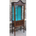 An Edwardian display cabinet with decorative painted to simulate inlay detail, freestanding and