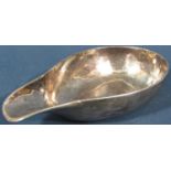 An early 18th century silver bloodletting bowl, oval with a pouring lip, 11cm wide, hallmarks rubbed