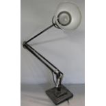 A mid 20th century black Anglepoise lamp on a stepped base, stamped Made in England, Herbert Terry &