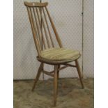 A set of four Ercol stained elm and beechwood high stick back dining chairs with cow horn rails,