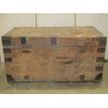 A 19th century stripped pine chest with reinforced steel banded corners hinged lid and twin locks (