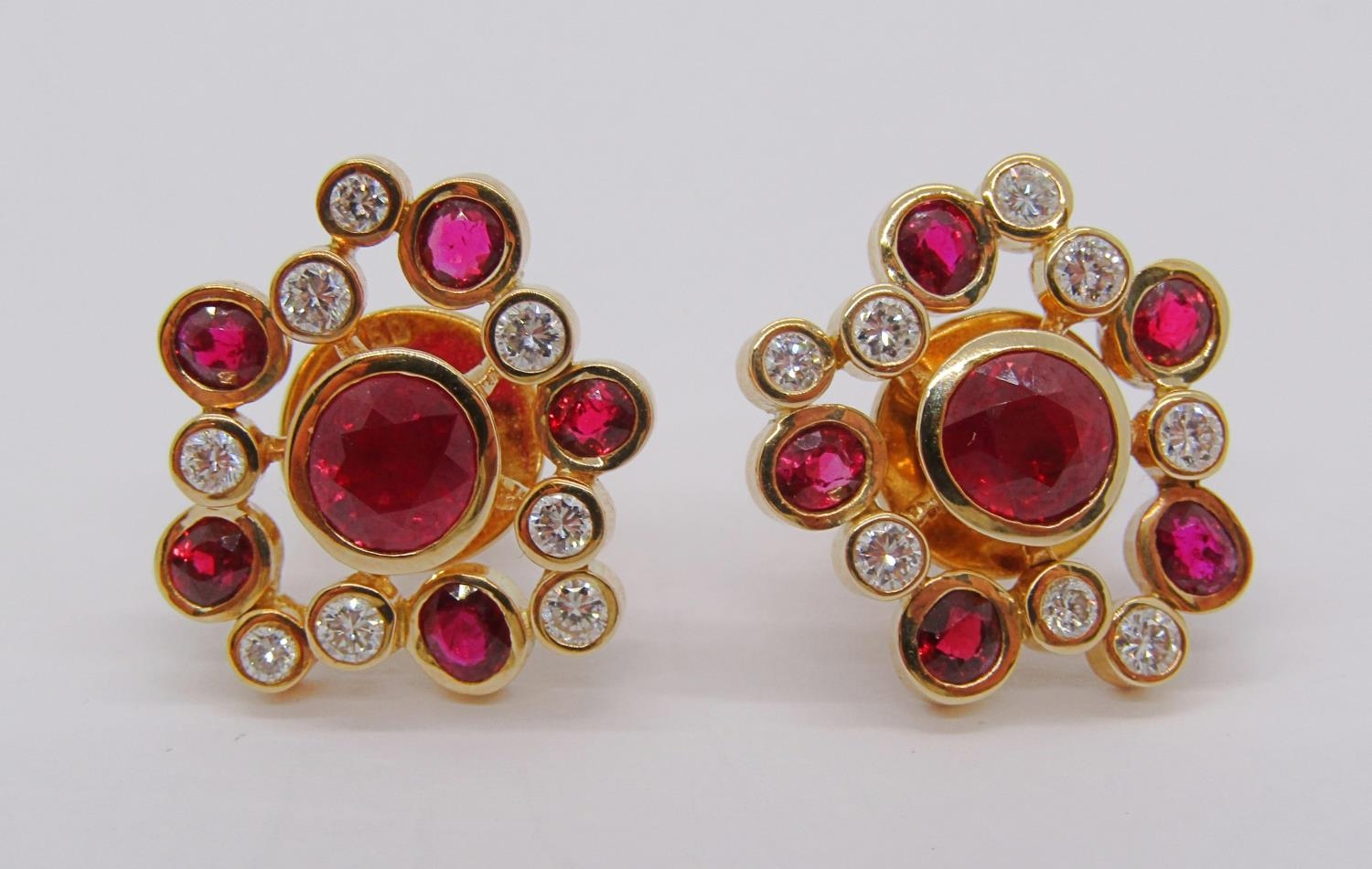 Stylised pair of 18ct ruby and diamond spray earrings, 12.2g