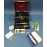 A leather jewel box containing prehistoric shark teeth, Wilkinson Sword pen knife, coinage, etc