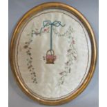 Georgian silk embroidery of basket of flowers and ribbons in glazed gilt oval frame 35 x 40 cm