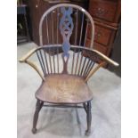 A 19th century Windsor hoop and stick back armchair, principally in elm and ash with pierced