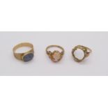 Three gold rings comprising a 14ct opal triplet ring, size S/T, together with a further 14ct example