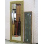 A contemporary gilt framed wall mirror of rectangular form with bevelled edge plate, repeating