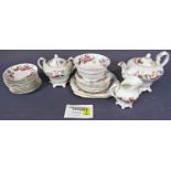A collection of tea wares with printed floral detail comprising teapot, covered sucrier, milk jug,
