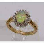 9ct opal and diamond oval cluster ring, size Q, 4.1g