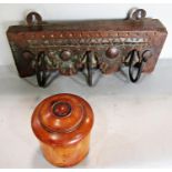 A 19th century walnut turned canister with a screw top and a portion of coat hooks on a carved