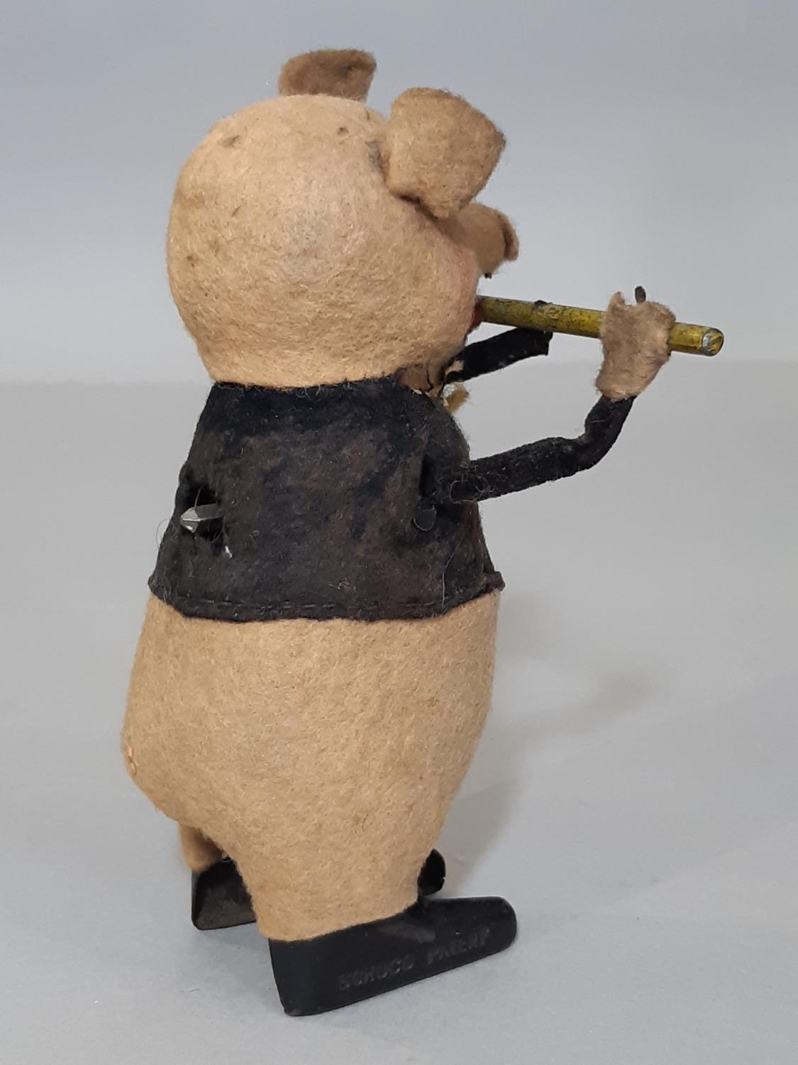 A Schuco clockwork toy in the form of a pig playing a flute, height 11cm, no key - Bild 3 aus 5