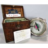 A pigeon racing automatic timing clock, in its original wooden box.