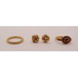 Group of 9ct jewellery comprising a twist ring, size L/M, further garnet cluster ring, size O and